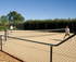 Full sized, flood lit tennis court